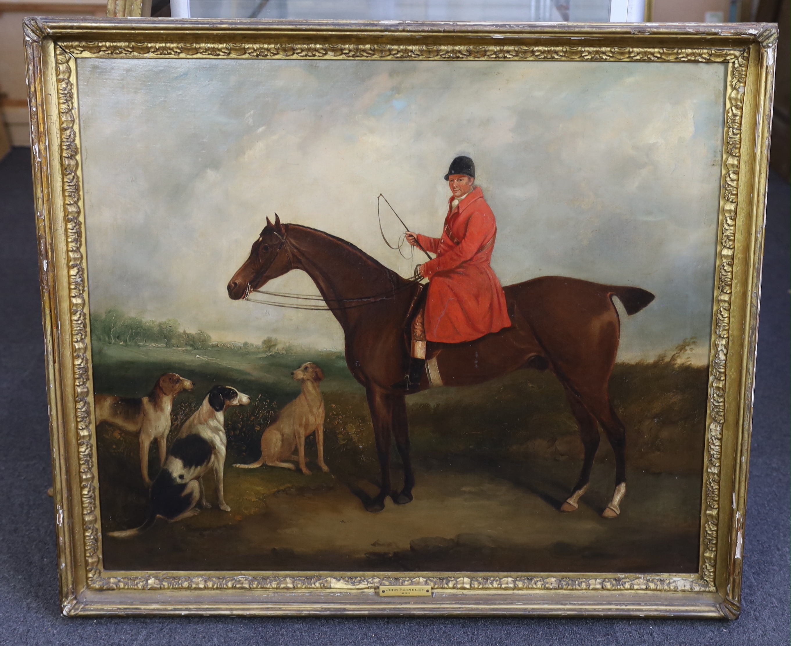 Circle of John Ferneley Snr (1762-1860), A huntsman and hounds in a landscape, oil on canvas, 69 x 81cm